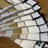 Upholstery fabric samples display showing chenille velvet and faux linen fabric swatches arranged in a fan pattern